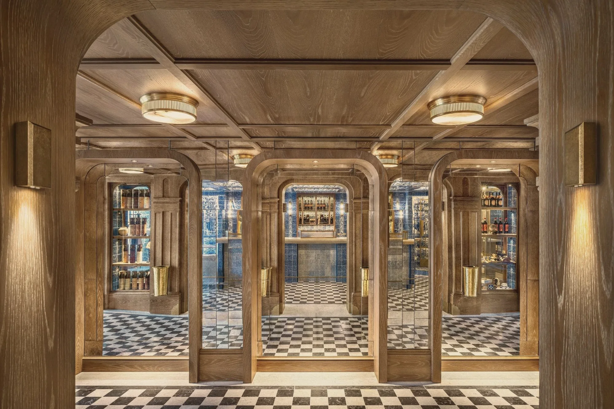The oak arches and mirrored passages of the renovated shop