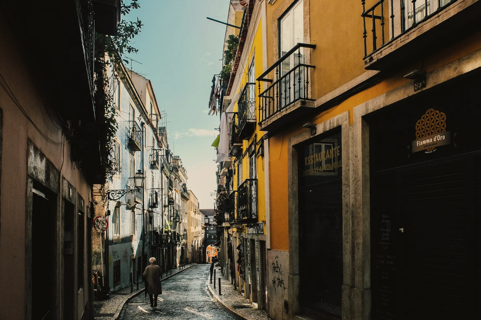 A Bairro Alto lane in late light