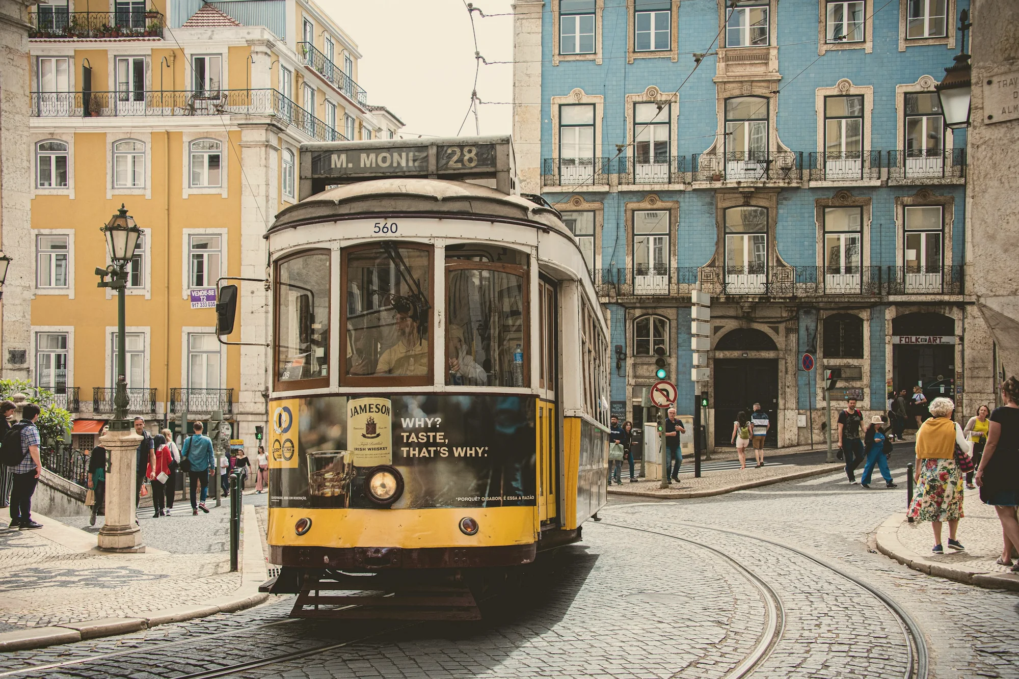 Tram 28 passing an azulejo façade
