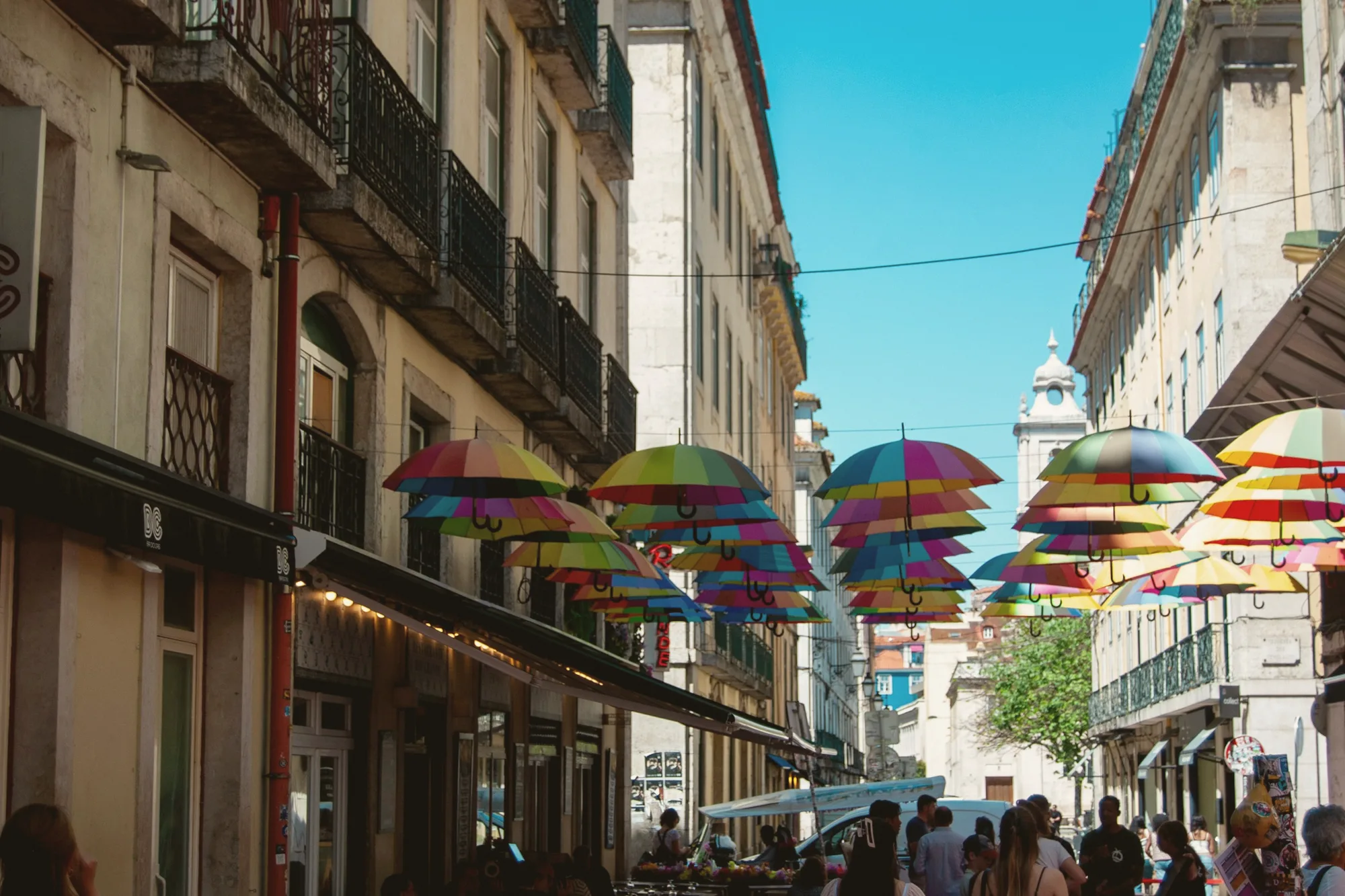 Umbrellas strung above the Cais do Sodré bar streets