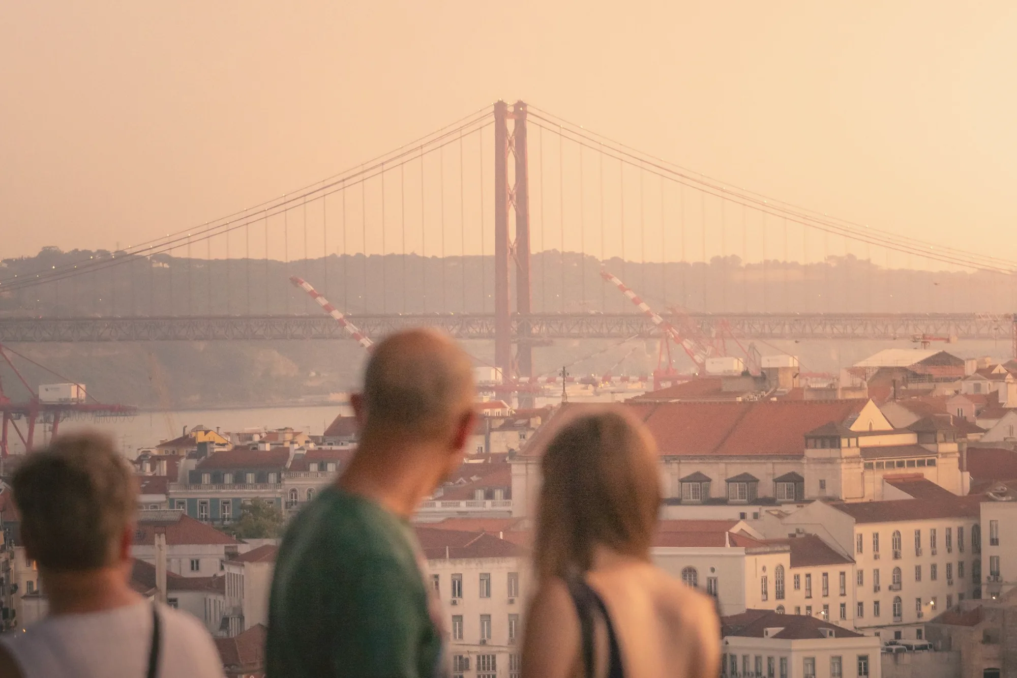 Sunset over the 25 de Abril bridge from Miradouro de Santa Catarina
