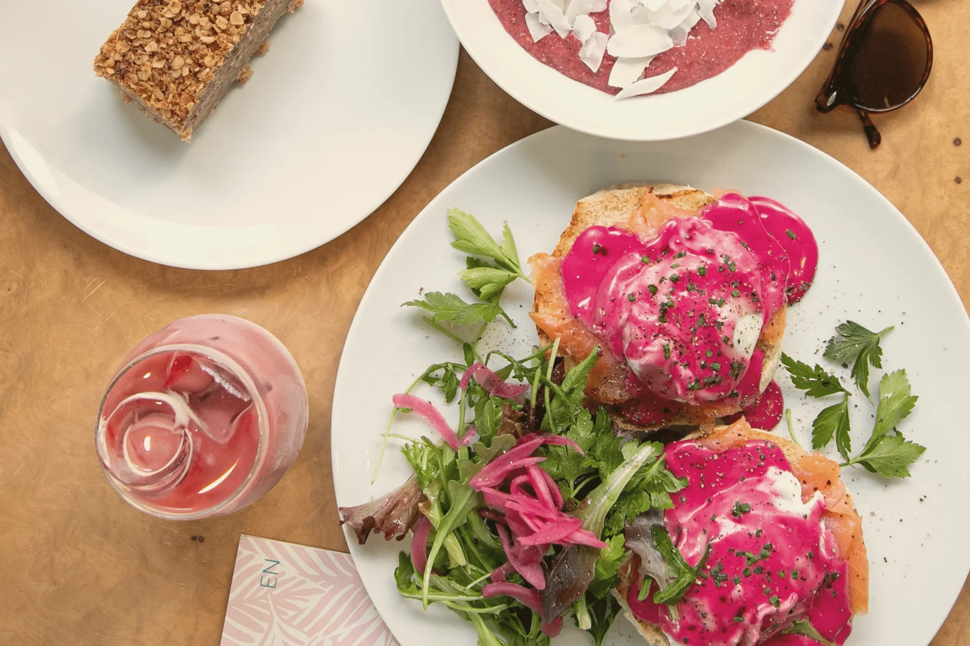Brunch at Mila: benedict with beetroot hollandaise, chia bowl, carrot cake