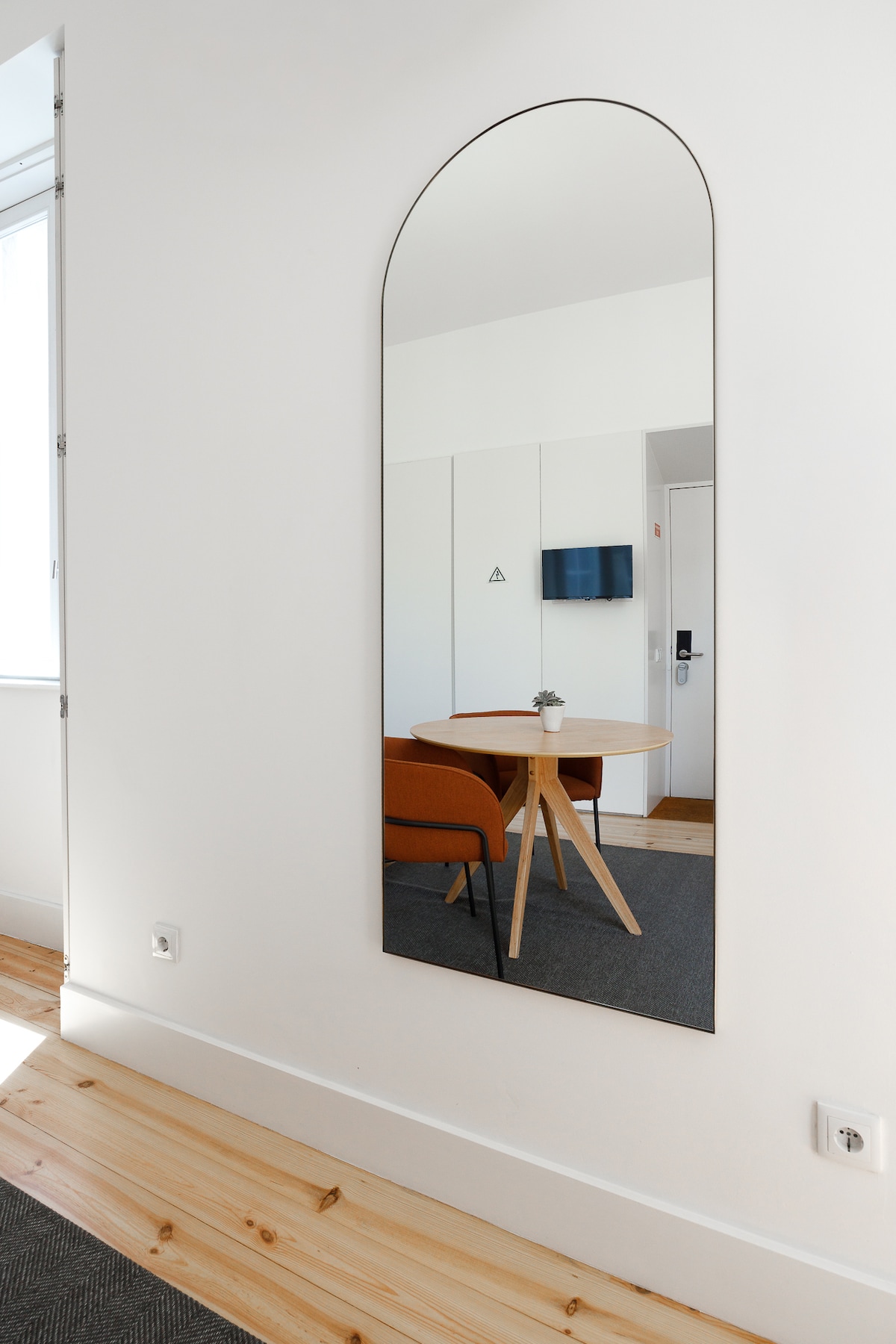 Arched mirror, entrance door with keypad lock
